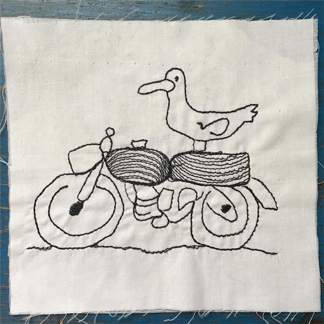 embroidery of line drawing, seagul on a motorcycle